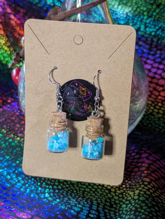 Light blue glow in the dark potion earrings