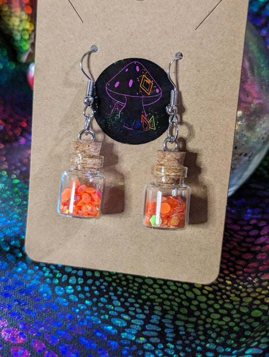 Orange glow in the dark potion earrings