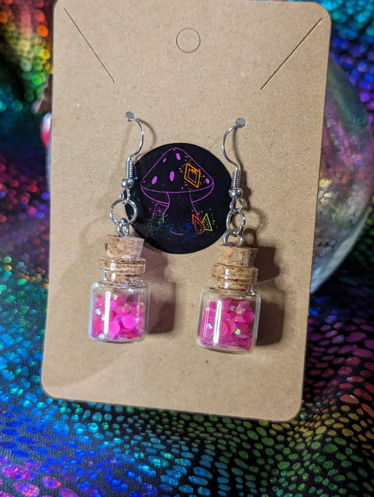 Pink glow in the dark potion earrings
